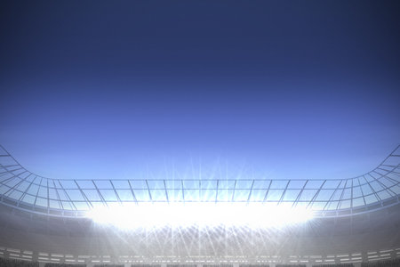 Digitally generated large football stadium with spotlights under dark blue skyの写真素材