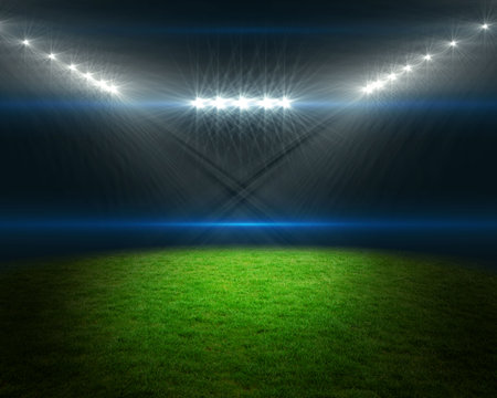 Digitally generated football pitch with bright lightsの写真素材