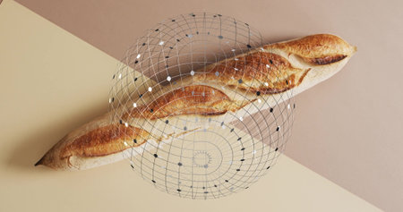 Resting single crusty baguette lying diagonally on cream taupe panels with digital grid overlay....