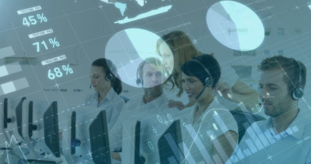 Support team wearing headsets working at desks in call center, displaying data charts and graphs. Collaboration, teamwork, analytics, communication, technology, business, professionalismの写真素材
