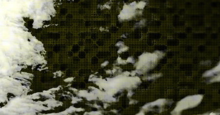 Displaying abstract white cloud-like shapes floating in digital art, with fine yellow grid overlay....