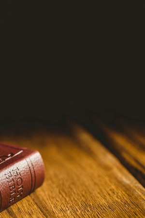 Close-up of bible on wooden table
