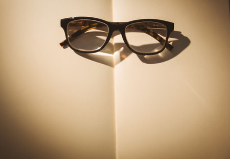 Directly above shot of eyeglasses on bookの写真素材