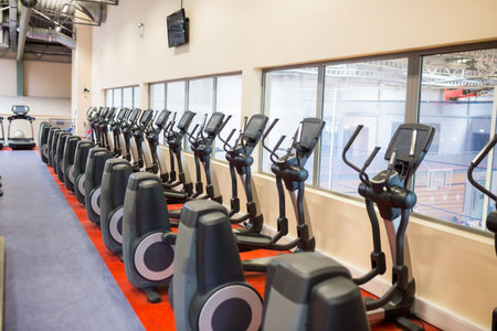 Cross trainers arranged in health club