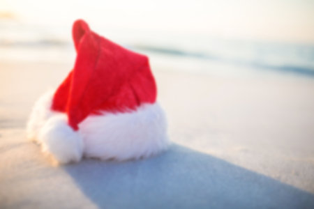 surface level view of santa hat on sunny beachの写真素材