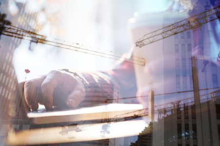 Digital composite image of businesswoman using laptop in officeの写真素材