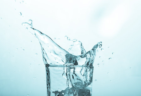 Close-up of water splashing in glass