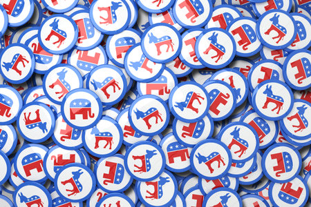 Showing overlapping flat design political buttons with red white blue donkey elephant icons. Patriotism, activism, democracy, campaigning, symbolism, political, awarenessの写真素材