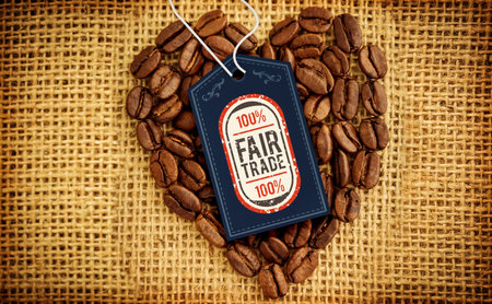 Quality tag over heart shape coffee beans on textileの写真素材