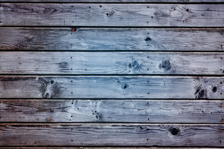 weathered wooden plank surface is being shown in flat design, featuring visible nail heads. Rustic,...