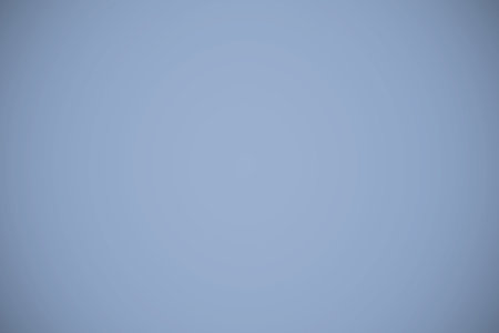 Uniform light blue gradient is flowing across frame in flat design with subtle radial shading. Abstract, calm, soothing, minimalist, digital art, background, tranquilityの写真素材