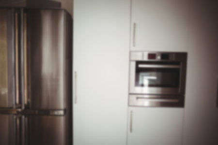 Refrigerator in kitchen at homeの写真素材