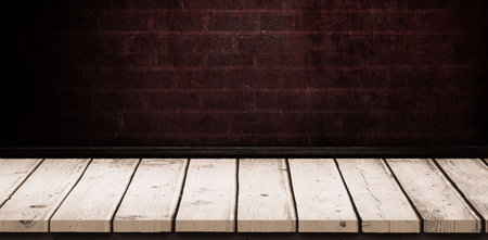 Wooden board against black backgroundの写真素材