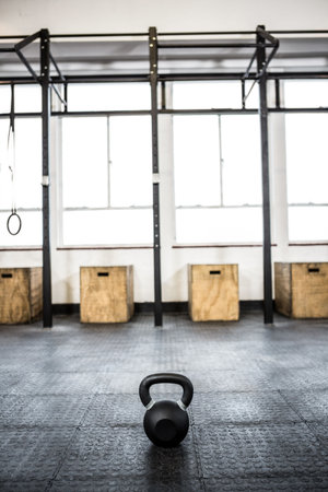 Kettlebell and boxes on floor at gymの写真素材