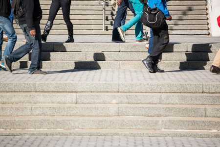 People walking on staircase at city