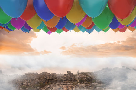 Many colourful balloons above landscapeの写真素材