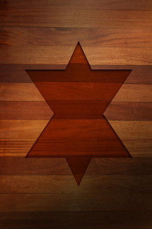 Recessed six-pointed star carving is showing on wooden plank surface in flat style, with shadowing. Craftsmanship, decor, rustic, textured, geometric, artistry, designの写真素材