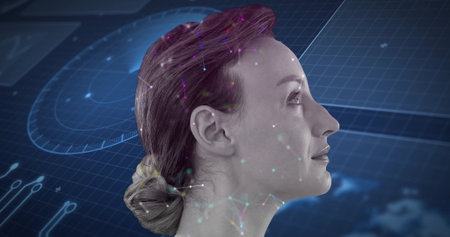 Displaying mid-adult woman head in right-profile on virtual interface background, with data dials....