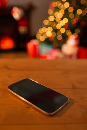 Smartphone on table at Christmas with copy spaceの写真素材