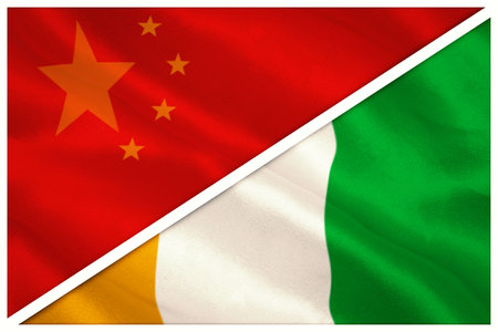 Close-up of Chinese and Ivory Coast flags against white backgroundの写真素材