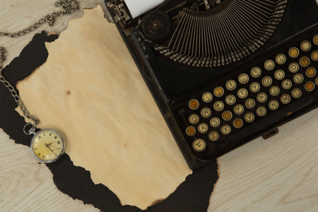 Paper piece, typewriter and clock on table, Close-upの写真素材