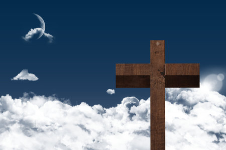 Flat design wooden cross is rising above clouds under blue sky, revealing moon and sun glare. Spiritual, celestial, minimalist, serenity, divine, transcendence, worshipの写真素材