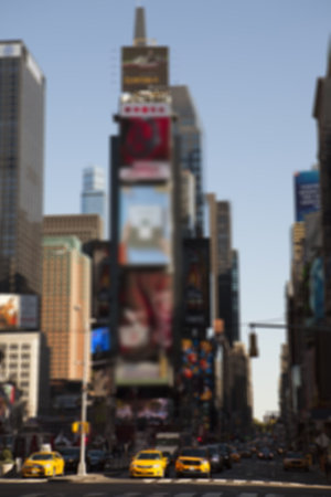 Flat design art is showing tall tower in busy crossroads with yellow taxis and digital billboards....