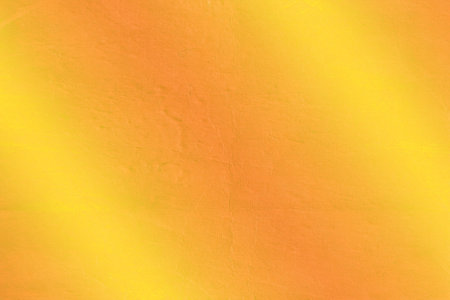 Textured warm yellow-orange gradient surface is being shown in flat style with diffused lighting....