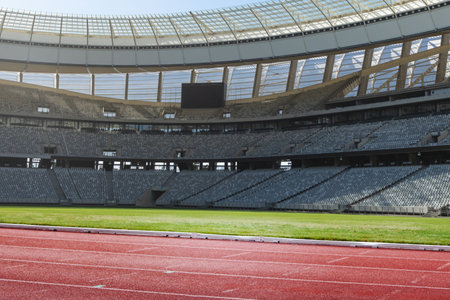 Flat design is showing empty stadium interior featuring red track green field gray seats scoreboard....