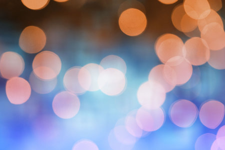 Cluster of blurred light orbs is forming abstract bokeh pattern on dark backdrop in flat design....