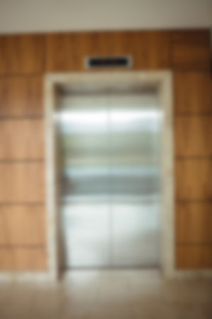 Defocused image of lift in modern office