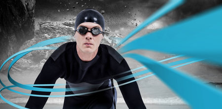 Portrait of swimmer against digitally generated blue lines and rock formationの写真素材