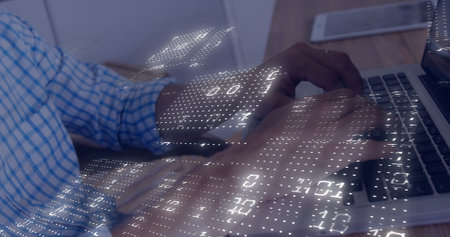 Typing hands in blue plaid sleeves tapping laptop keys at office desk, with smartphone data overlay....