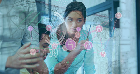 Manipulating analyst in turquoise top using stylus on display in office room with map grid overlay....