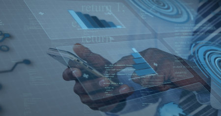 Adult male hands with suit cuff holding smartphone in workspace, with 3D charts and code text....