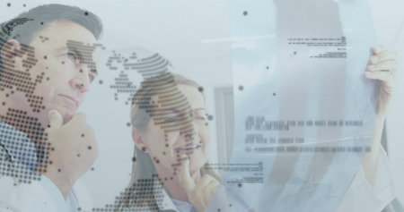 Lab coat wearing doctors examining radiograph film on glass wall in clinical lab, with map overlays....