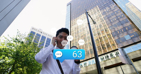 Standing man wearing white shirt speaking into smartphone on street, with coffee cup, chat bubble. Urban, professional, lifestyle, modern, business, communication, cityscapeの写真素材