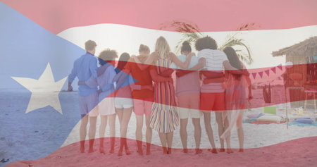 Standing friends holding shoulders on sandy beach facing sea, with tiki bar, bunting and floats. Vacation, camaraderie, leisure, island, relaxation, festive, summerの写真素材