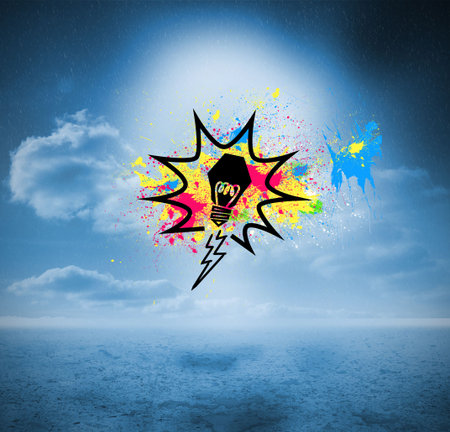 Light bulb on splashes over blue countrysideの写真素材