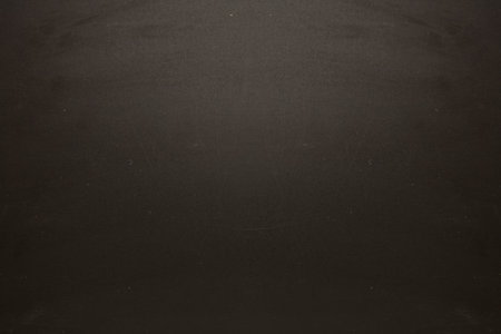Dark textured surface is covering full width in flat design, showing subtle speckled pattern. Abstract, minimalist, pattern, background, textured, modern, sleekの写真素材
