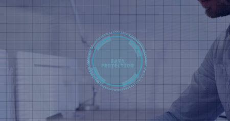 Displaying interface labeled DATA PROTECTION hovering over office desk with computer monitor. Technology, cybersecurity, digital, innovation, professional, workspace, futuristicの写真素材