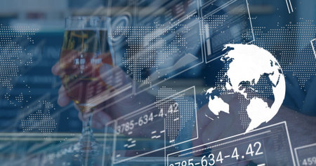 Holding stemmed glass, executive in suit monitoring global data panels at office desk, copy space....