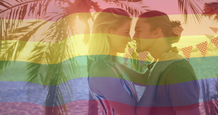 Leaning couple sharing intimate moment on tropical beach, with bunting flags overhead, copy space. Romance, relaxation, tropical, bohemian, leisure, vibrant, scenicの写真素材