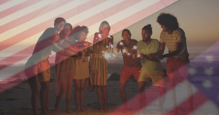 Holding sparklers friends in summer clothes celebrating on sandy beach at sunset, with flag overlay....