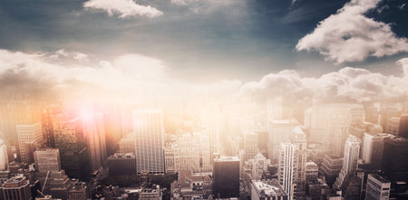 High angle view of cityscape by mountains during sunsetの写真素材
