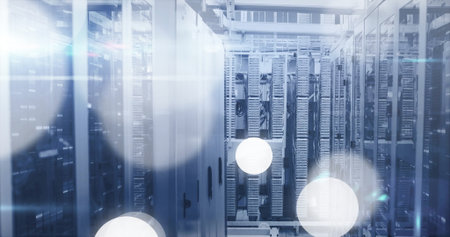 Standing central server cabinets in data center corridor, with blade servers and bundled cabling....