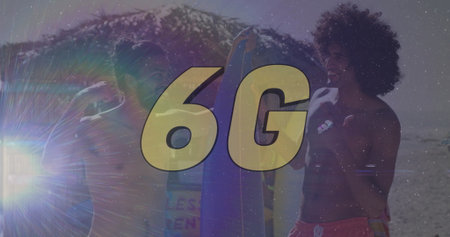 Standing surfers in board shorts holding surfboards with beach waves, lens flare, golden 6G overlay. Adventure, outdoor, dynamic, energetic, leisure, youthful, vibrantの写真素材