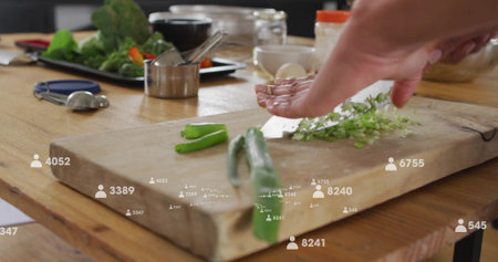 Chopping adult woman preparing herbs with knife on wooden cutting board, floating follower icons....