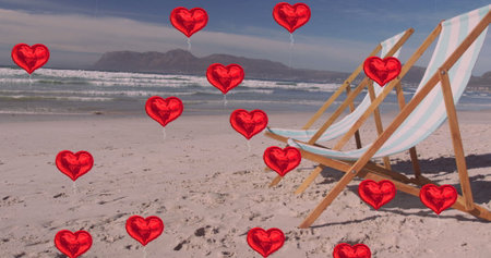 Featuring two wooden deck chairs on sandy beach, floating red heart-shaped balloons, copy space. Coastal, relaxation, leisure, vintage, romantic, outdoor, horizonの写真素材