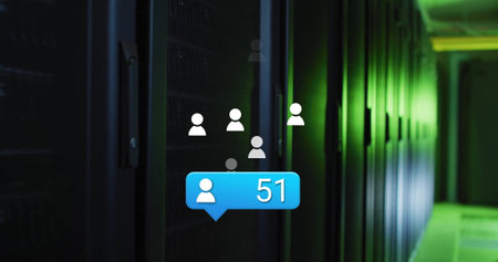 Displaying blue notification bubble pulsing on server racks in data center aisle, green LED lights. Technology, data, cybersecurity, networking, innovation, futuristic, illuminationの写真素材